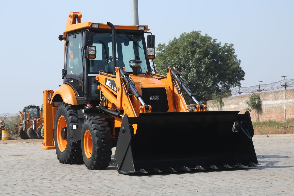 Backhoe loader on a paved yard